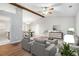 Cozy living room with hardwood floors, comfortable seating, and an open layout at 3448 Great Meadows Ct, Lithonia, GA 30038