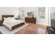 Bedroom with hardwood floors, two windows, and a complete furniture set at 3448 Great Meadows Ct, Lithonia, GA 30038
