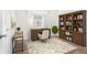 Home office with a desk, chair, bookshelf, and natural lighting, ideal for remote work at 3448 Great Meadows Ct, Lithonia, GA 30038