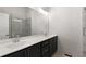 Modern bathroom with double vanity, large mirror, and glass enclosed shower at 913 Spencer Ave, Atlanta, GA 30318