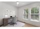 Bright bedroom or office space with desk, windows, and ceiling fan at 913 Spencer Ave, Atlanta, GA 30318