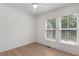 Bright bedroom featuring two windows and hardwood floors at 913 Spencer Ave, Atlanta, GA 30318
