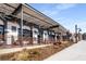 Stylish exterior of a commercial building featuring a modern design with outdoor seating and pedestrian walkway at 913 Spencer Ave, Atlanta, GA 30318