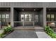 Exterior view of townhomes with private front porches and landscaping at 913 Spencer Ave, Atlanta, GA 30318