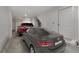 Spacious two-car garage featuring a red SUV and a grey sedan, offering ample parking and storage space at 913 Spencer Ave, Atlanta, GA 30318