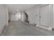 Clean and spacious two-car garage with a smooth concrete floor, a water heater, and an automatic door opener at 913 Spencer Ave, Atlanta, GA 30318