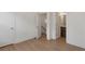 Hallway view with white walls, wood floors and multiple doorways at 913 Spencer Ave, Atlanta, GA 30318