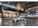Spacious food hall with chandelier, various food vendors, bar, tables and modern industrial design elements at 913 Spencer Ave, Atlanta, GA 30318