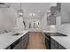 Galley kitchen boasts gray cabinets, stainless steel appliances, and a quartz countertop island at 913 Spencer Ave, Atlanta, GA 30318
