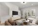 Comfortable living area featuring a TV, and a marble coffee table at 913 Spencer Ave, Atlanta, GA 30318