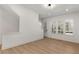 Well-lit living room boasting hardwood floors, stairs, and white walls at 913 Spencer Ave, Atlanta, GA 30318