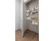 Well-organized pantry with shelving stocked with a variety of food items and storage containers at 913 Spencer Ave, Atlanta, GA 30318