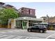 Inviting restaurant exterior with outdoor seating, green accents, and roadside access at 913 Spencer Ave, Atlanta, GA 30318