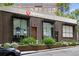 Retail storefront with large windows, attractive display, and landscaping at 913 Spencer Ave, Atlanta, GA 30318