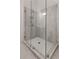 Modern glass shower with gray tiling and tiled shower niche at 913 Spencer Ave, Atlanta, GA 30318