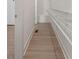 Bright walk-in closet with shelving, hanging space, and wood flooring at 913 Spencer Ave, Atlanta, GA 30318