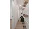 Organized walk-in closet with shelving, hanging space, and wood flooring at 913 Spencer Ave, Atlanta, GA 30318