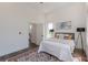 Bedroom with hardwood floors, a rug, and a peek into a modern-styled en suite bathroom at 1300 Memorial Se Dr # 12, Atlanta, GA 30317