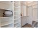 Walk-in closet with custom shelving and ample storage space at 1300 Memorial Se Dr # 12, Atlanta, GA 30317