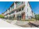 Modern townhomes showcasing clean architectural lines, large windows, and fenced front yards at 1300 Memorial Se Dr # 12, Atlanta, GA 30317