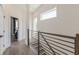 Hallway with hardwood floors, modern railing, and natural light from windows at 1300 Memorial Se Dr # 12, Atlanta, GA 30317