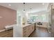 Bright kitchen with stainless steel appliances and modern lighting fixtures at 1300 Memorial Se Dr # 12, Atlanta, GA 30317