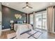 Stylish main bedroom with dark walls, large windows, and a contemporary rug at 1300 Memorial Se Dr # 12, Atlanta, GA 30317