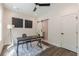 Bright home office with modern desk, stylish decor, ceiling fan and an en suite bathroom at 1300 Memorial Se Dr # 12, Atlanta, GA 30317