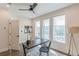 Inviting home office with a dark modern desk, stylish lamp, rug and lots of natural light at 1300 Memorial Se Dr # 12, Atlanta, GA 30317