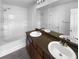 Bathroom featuring double sinks, a soaking tub, and a shower with tile surround at 148 Hill Side Way, Hiram, GA 30141