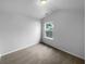 Bedroom features carpet flooring, a window, and fresh paint at 148 Hill Side Way, Hiram, GA 30141