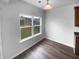 Dining area with hardwood floors and a large window overlooking the backyard at 148 Hill Side Way, Hiram, GA 30141