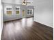 Spacious living room with hardwood floors, neutral paint, abundant natural light, and a ceiling fan at 148 Hill Side Way, Hiram, GA 30141