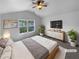 Comfortable main bedroom with vaulted ceilings, a large window, and neutral décor at 148 Hill Side Way, Hiram, GA 30141