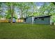 Lush backyard featuring a shed, covered patio, and ample green space at 2781 Long Way, Decatur, GA 30032