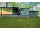 Exterior rear view of home with covered patio and large grassy backyard at 2781 Long Way, Decatur, GA 30032