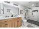 Modern bathroom with a dual vanity, stylish fixtures, and glass-enclosed shower at 2781 Long Way, Decatur, GA 30032