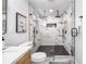 Sleek bathroom boasting a glass shower with dual shower heads and marble-patterned tile at 2781 Long Way, Decatur, GA 30032