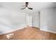 Bright bedroom with a modern ceiling fan, light walls, hardwood floors and closet at 2781 Long Way, Decatur, GA 30032