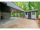 Carport and storage building featuring covered parking and a shed set amidst lush greenery at 2781 Long Way, Decatur, GA 30032