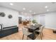 Open-concept dining area with modern decor seamlessly connects to the stylish kitchen at 2781 Long Way, Decatur, GA 30032