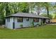 Well-maintained one-story home featuring a manicured lawn and tidy landscaping at 2781 Long Way, Decatur, GA 30032