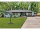 Inviting one-story home with a lush green lawn and concrete drive leading to a welcoming front porch at 2781 Long Way, Decatur, GA 30032