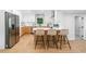 Eat-in kitchen with stainless steel refrigerator, white cabinets, island with barstool seating at 2781 Long Way, Decatur, GA 30032
