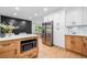 Modern kitchen with island, stainless steel appliances, white cabinets, and sleek countertops at 2781 Long Way, Decatur, GA 30032