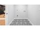 Laundry room with patterned black and white flooring and light gray walls at 2781 Long Way, Decatur, GA 30032