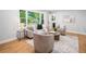 Bright and airy living room with hardwood floors and neutral-toned furniture at 2781 Long Way, Decatur, GA 30032