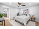 Comfortable bedroom features a neutral color palette, ceiling fan and hardwood floors at 2781 Long Way, Decatur, GA 30032