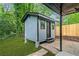 Backyard shed with modern design and matching trim to the main house at 2781 Long Way, Decatur, GA 30032
