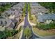 Aerial view of a residential community showcasing tree-lined streets and well-maintained homes at 4321 Lanier Ridge Walk # 1704, Cumming, GA 30041